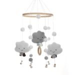 This delicate crib chime features soft felt balls that gently sway, capturing your baby's attention.