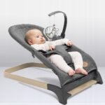 This foldable rocker features a design that's both lightweight and portable, equipped with toys to engage your baby. It's suitable for infants, promoting a natural rocking motion that aids in soothing. The rocker also includes safety belts for secure use.