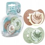 Set of two soothing symmetrical silicone pacifiers designed for girls aged 18 months and older, featuring a convenient storage case. Safe and BPA-free.