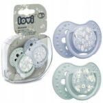 Set of two symmetrical silicone pacifiers designed for boys aged 18 months and older, featuring a convenient storage case. Safe and BPA-free.