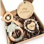 Customized pacifier pendant with name engraving and a teether included, perfect for baby showers. Stylish and practical for keeping pacifiers secure.