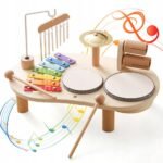 Montessori Musical Instruments for Children – an educational music table featuring various instruments to promote creativity, coordination, and musical skills in young children.
