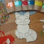 Wooden Sensory Dumping - Montessori Help (LIS) – a wooden sensory toy designed to aid in fine motor skills development and sensory exploration, based on Montessori principles.